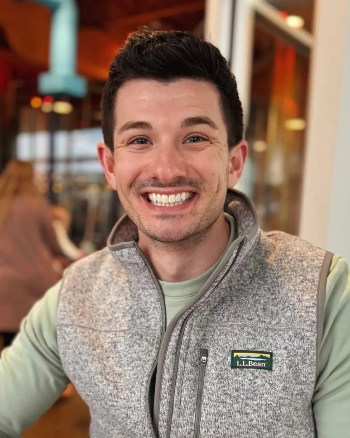 Alex Hille smiling outdoors
